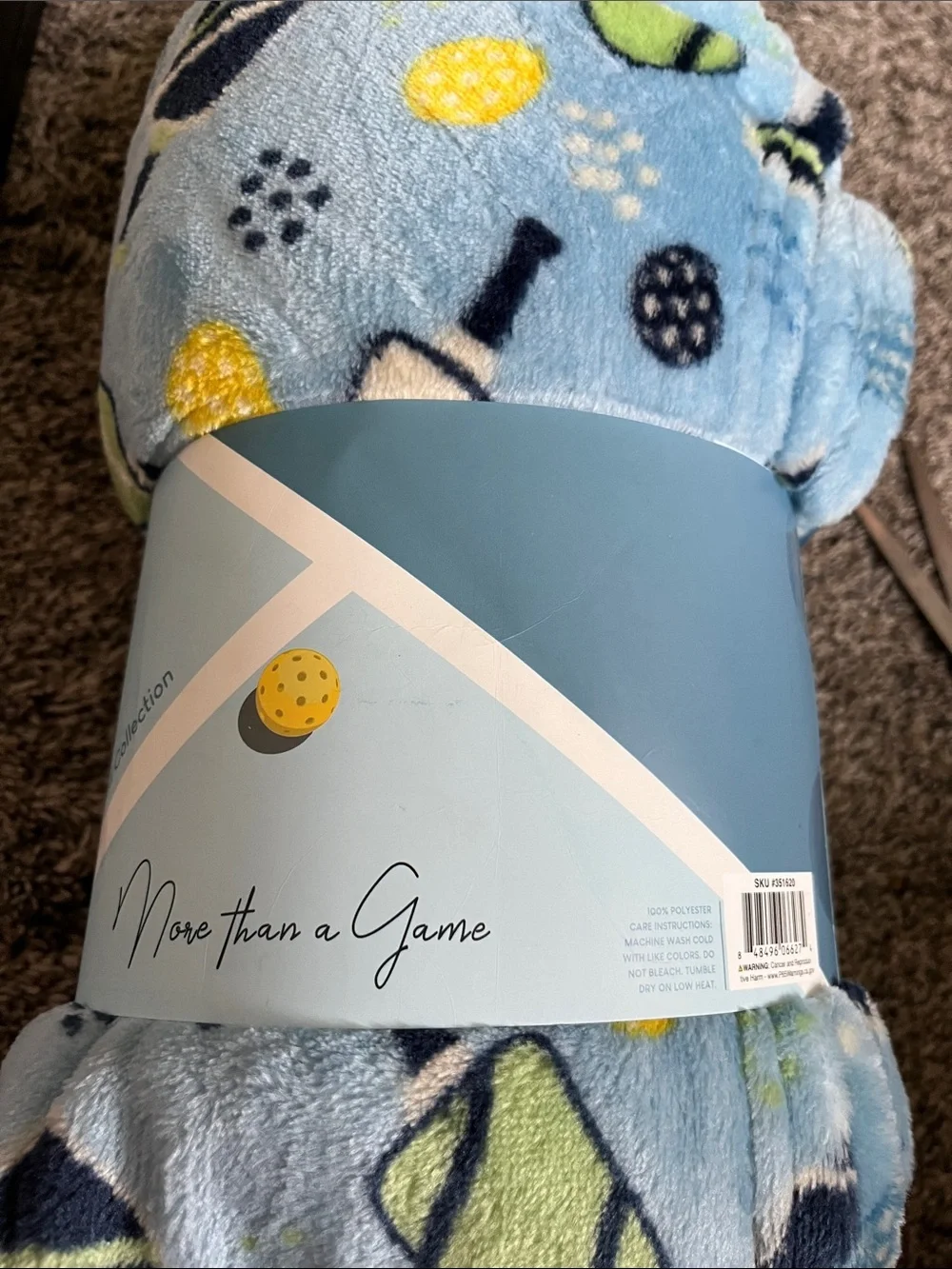 Plush Throw Blanket in Light Blue with pickleball. Polyester. New. 50x60. New.